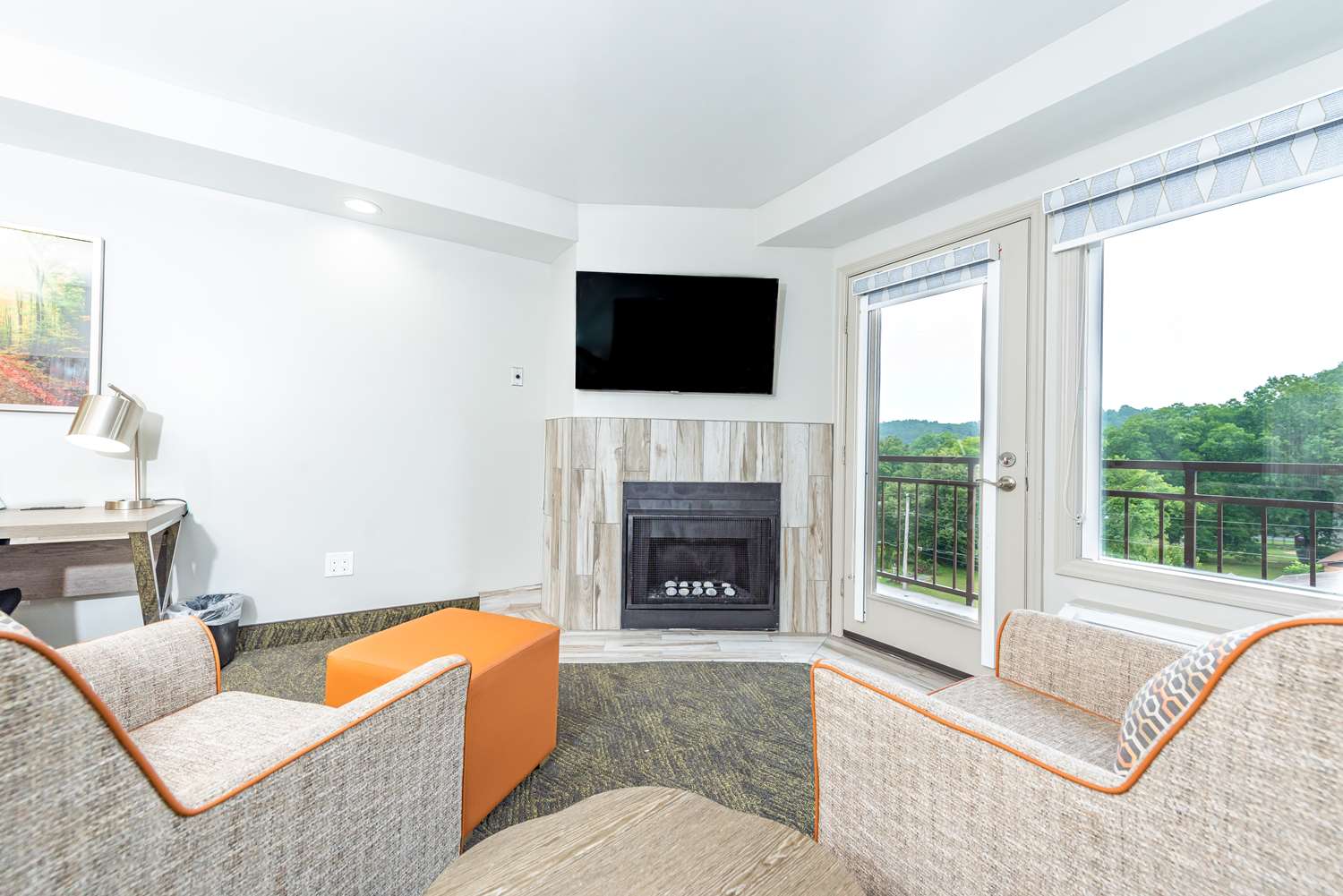 Fireplace Whirlpool Suite with king bed, stone fireplace, and whirlpool tub